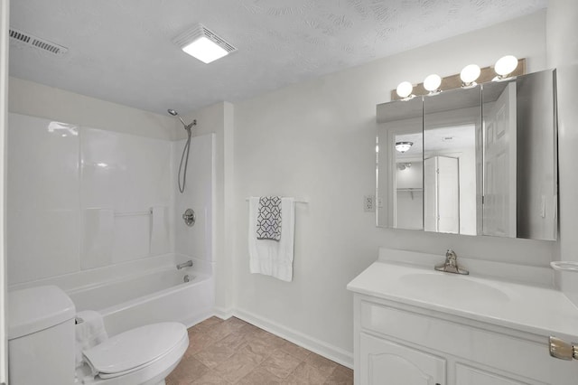 full bathroom featuring washtub / shower combination, vanity, toilet, and a textured ceiling