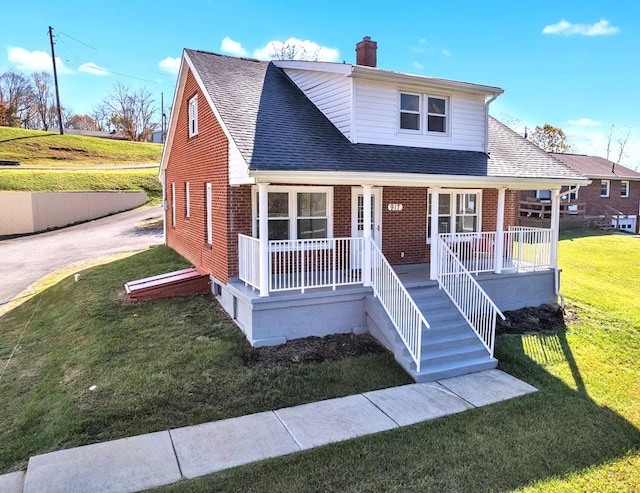 bungalow featuring a front yard and covered porch