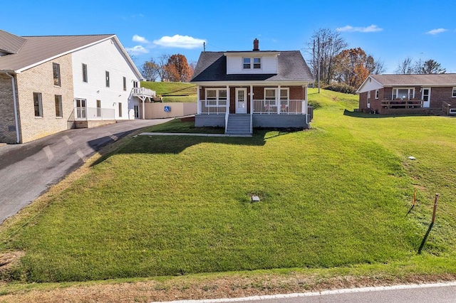 bungalow-style house with a porch and a front lawn