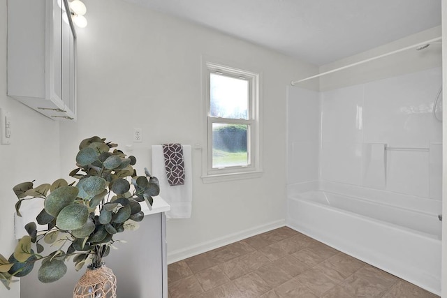 bathroom with shower / washtub combination