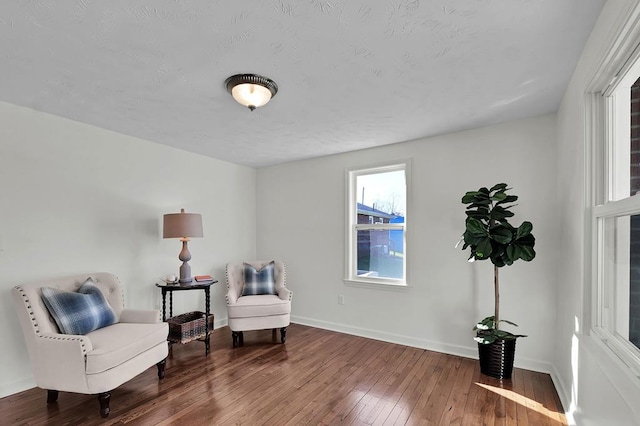 living area featuring hardwood / wood-style floors