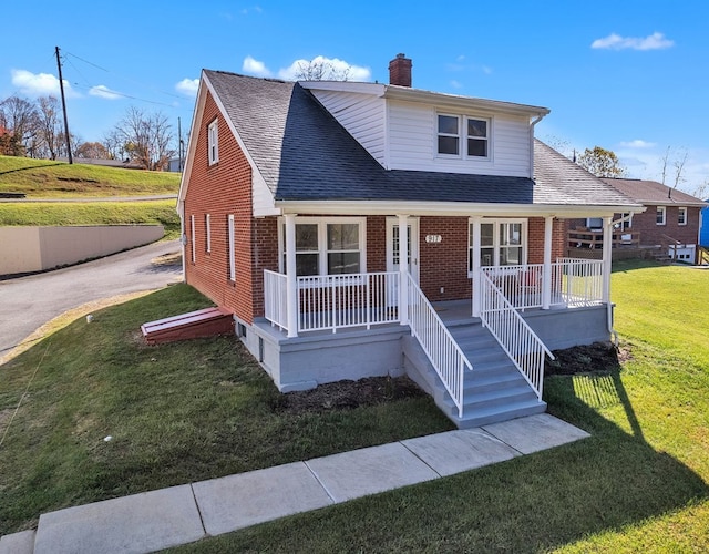 bungalow with a porch and a front yard