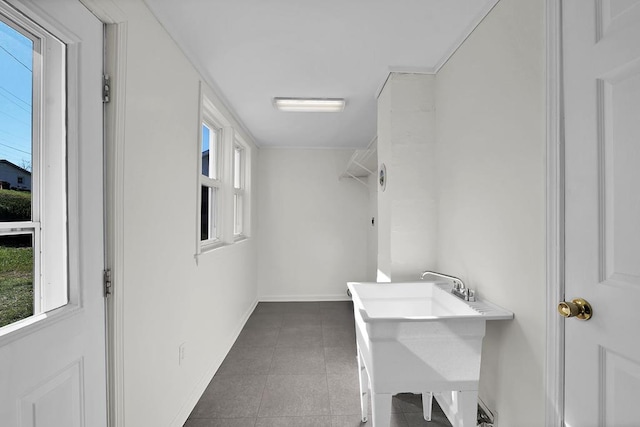 bathroom with sink and tile patterned flooring