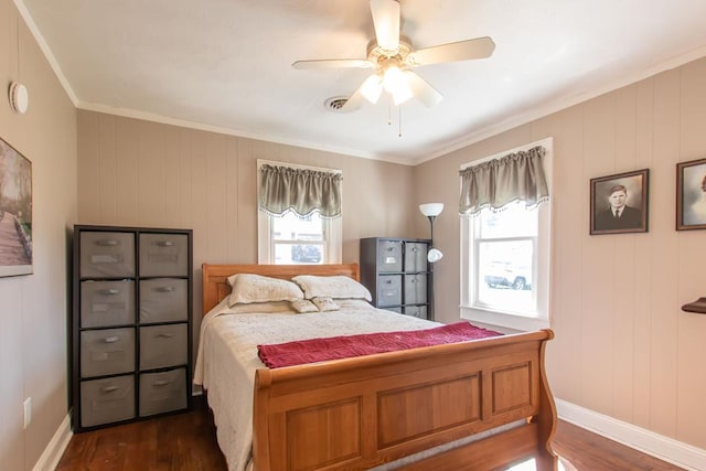 bedroom featuring crown molding, dark wood-style flooring, multiple windows, and visible vents