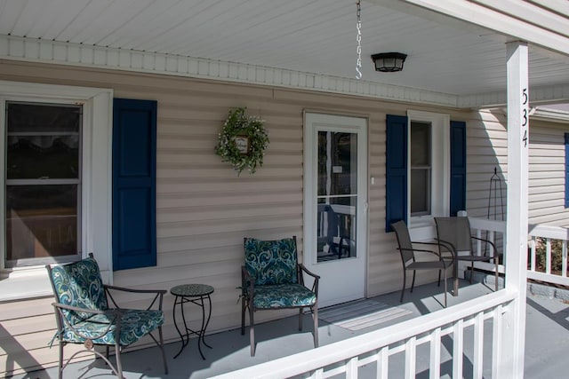 wooden terrace with a porch