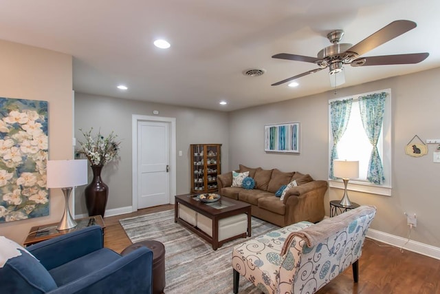 living room featuring baseboards, visible vents, recessed lighting, wood finished floors, and ceiling fan