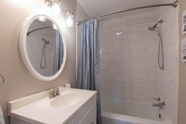 bathroom with shower / tub combo with curtain and vanity