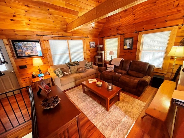 living room with wood-type flooring, vaulted ceiling with beams, wooden ceiling, and wooden walls