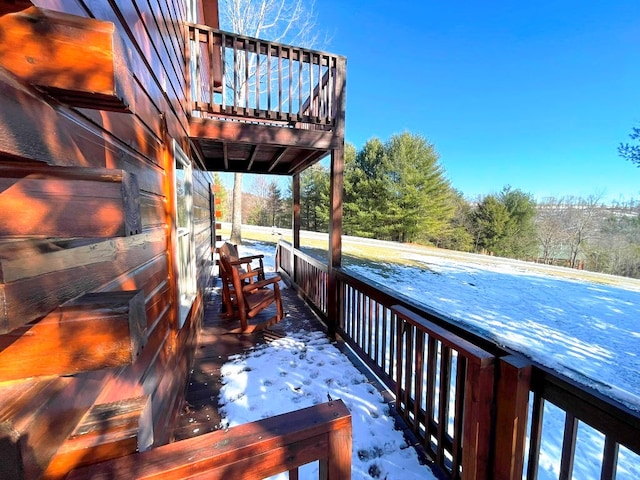 view of snow covered deck