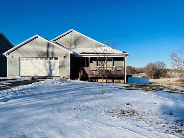 view of front of house featuring a garage and covered porch