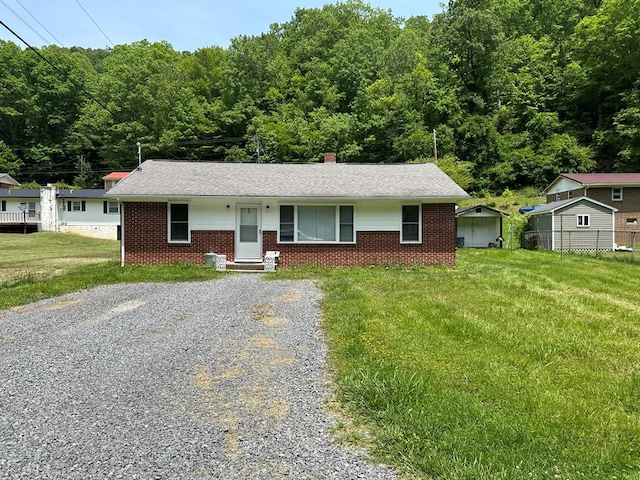 194 Gate Rd, Richlands, VA 24641 - ranch-style home with driveway, brick siding, a storage shed, a shingled roof, and a chimney