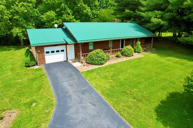 15296 Blueberry Ln, Chilhowie, VA 24319 - chalet / cabin with covered porch, a garage, asphalt driveway, a front lawn, and metal roof