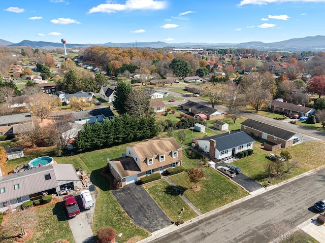 drone / aerial view featuring a residential view and a mountain view