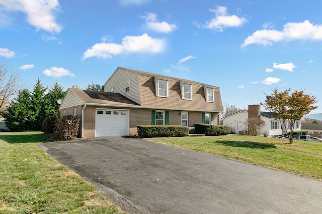 view of front of property with a gambrel roof, driveway, a front yard, an attached garage, and brick siding