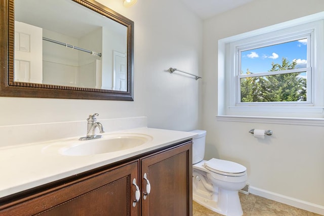 full bath with baseboards, toilet, tile patterned flooring, and vanity