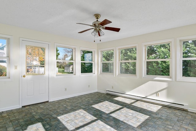 unfurnished sunroom featuring baseboard heating