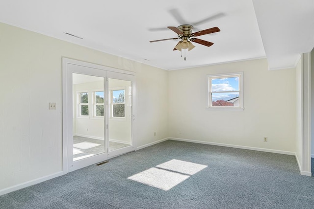 unfurnished bedroom with carpet flooring, baseboards, and visible vents