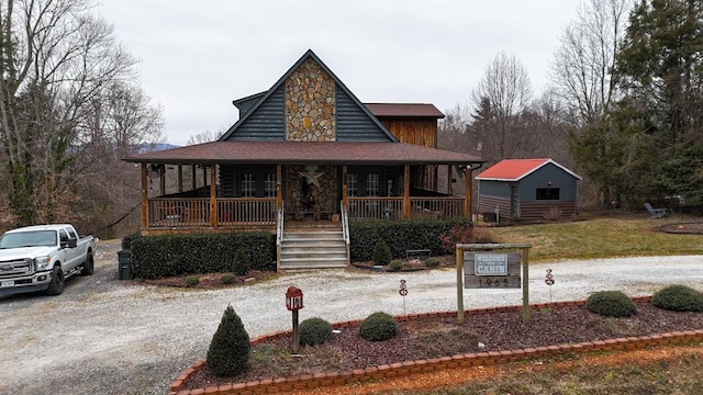 view of front of house with a porch and a front yard