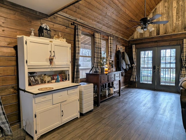 kitchen featuring dark wood-style floors, wood ceiling, white cabinetry, and vaulted ceiling