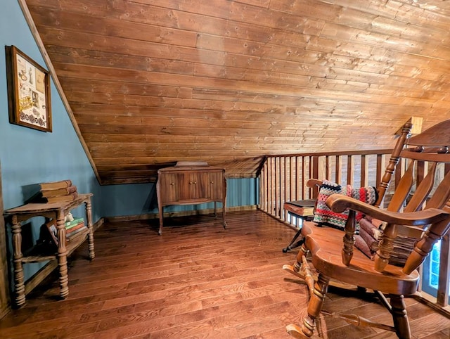 sitting room featuring vaulted ceiling and wood finished floors