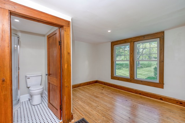 unfurnished room featuring recessed lighting, baseboards, and light wood-style floors