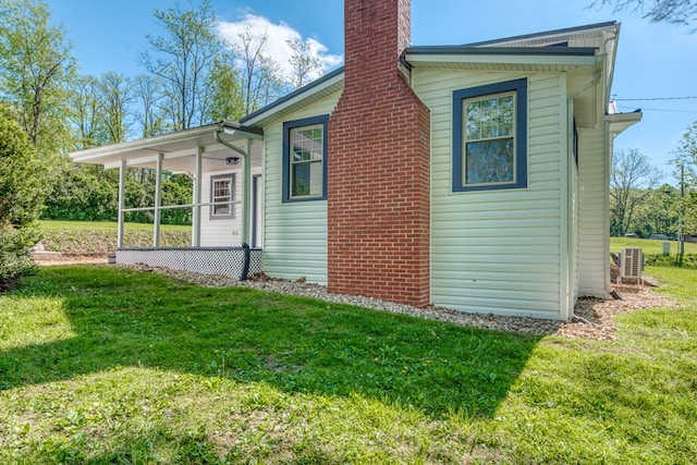 view of property exterior featuring a lawn and a chimney