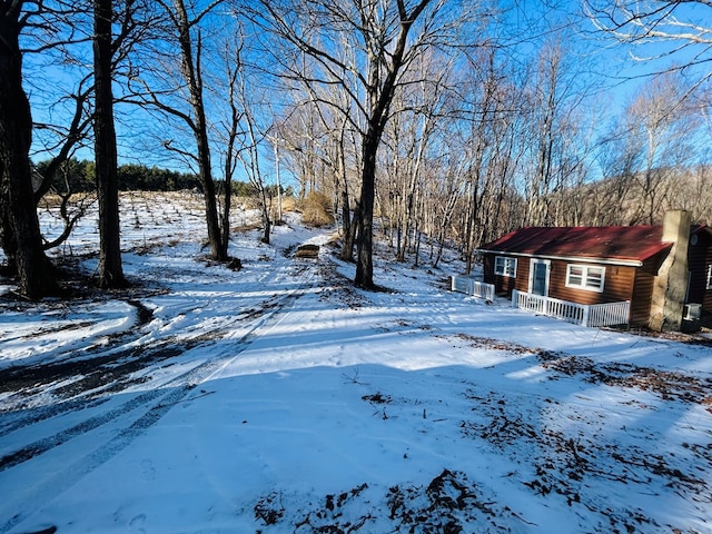 view of yard layered in snow