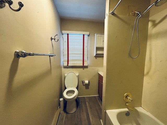 full bathroom with hardwood / wood-style flooring, vanity, toilet, and bathtub / shower combination