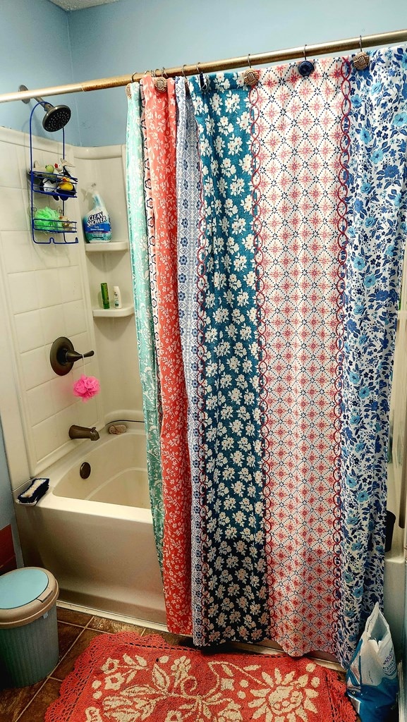 full bath featuring tile patterned floors and shower / bath combo