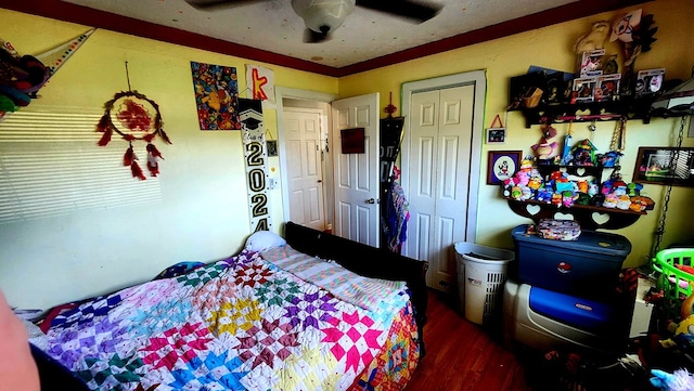 bedroom with ceiling fan and wood finished floors