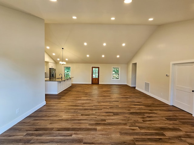 313 Fox Run Dr, Galax, VA 24333 - unfurnished living room featuring high vaulted ceiling, recessed lighting, and dark wood-style floors
