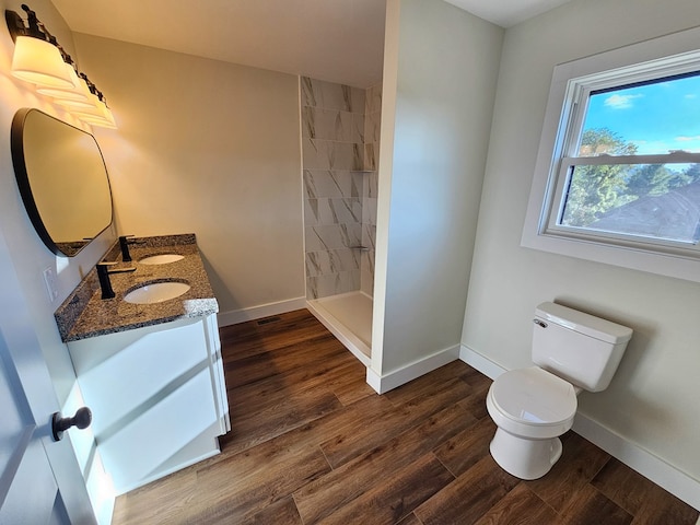 313 Fox Run Dr, Galax, VA 24333 - bathroom with double vanity, wood finished floors, and a tile shower