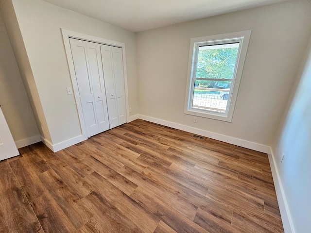 313 Fox Run Dr, Galax, VA 24333 - unfurnished bedroom featuring wood finished floors and a closet