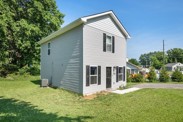 1048 Preston Dr, Radford, VA 24141 - view of home's exterior featuring a cooling unit and a yard