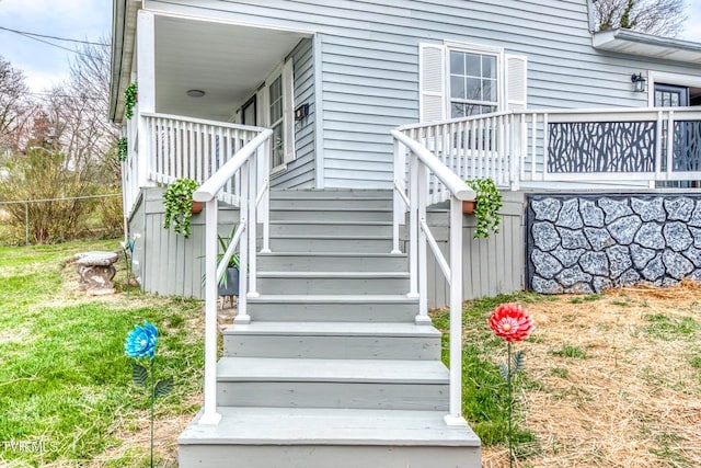 view of exterior entry featuring a porch
