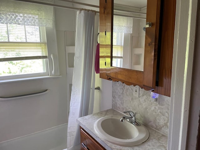 419 Adams St, Marion, VA 24354 - full bathroom with vanity, shower / bathtub combination with curtain, and backsplash