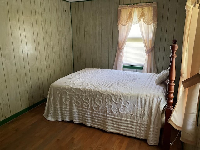 419 Adams St, Marion, VA 24354 - bedroom with wood walls and wood finished floors
