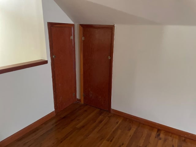 419 Adams St, Marion, VA 24354 - spare room with lofted ceiling and wood finished floors