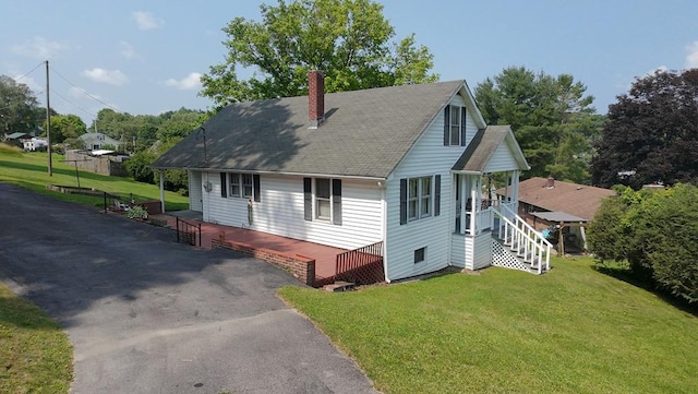 419 Adams St, Marion, VA 24354 - view of front of property featuring a chimney, a front lawn, a shingled roof, asphalt driveway, and stairs