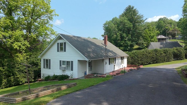 419 Adams St, Marion, VA 24354 - view of front facade with a chimney, a front lawn, and cooling unit