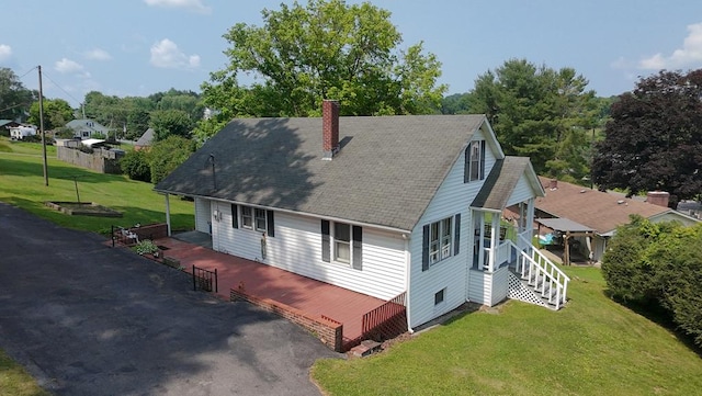 419 Adams St, Marion, VA 24354 - view of home's exterior featuring a chimney, a shingled roof, a yard, and stairway