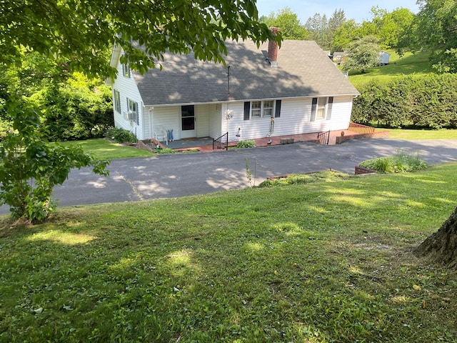 419 Adams St, Marion, VA 24354 - new england style home featuring a shingled roof, a front lawn, and a chimney