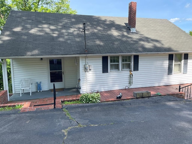 419 Adams St, Marion, VA 24354 - view of front of house with a chimney, a shingled roof, and a deck