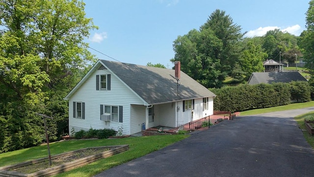 419 Adams St, Marion, VA 24354 - view of front of property featuring a chimney, a front yard, roof with shingles, and cooling unit