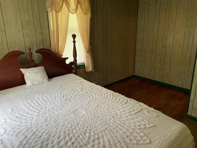 419 Adams St, Marion, VA 24354 - bedroom featuring dark wood-style flooring and wooden walls