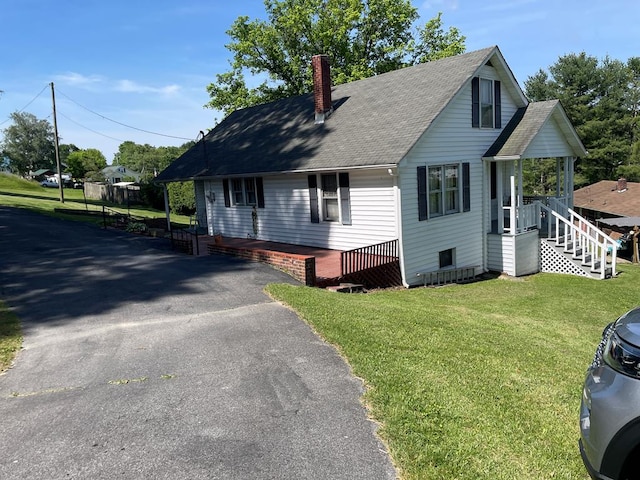 419 Adams St, Marion, VA 24354 - view of front of property with a chimney, a front lawn, a shingled roof, and asphalt driveway