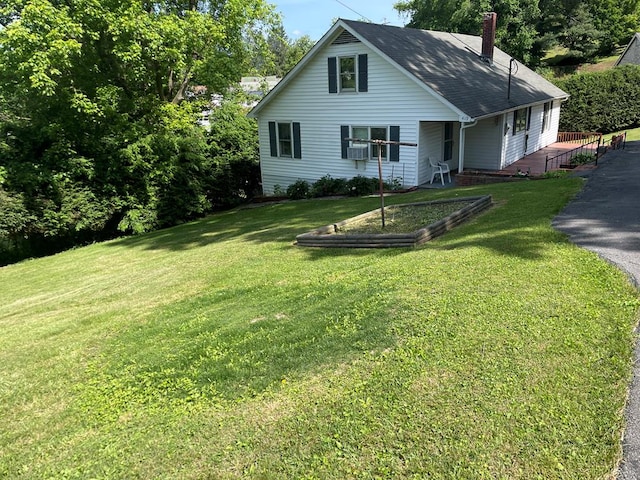 419 Adams St, Marion, VA 24354 - view of front facade with a chimney, a front yard, and a vegetable garden