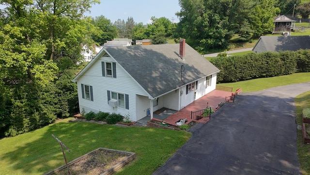 419 Adams St, Marion, VA 24354 - view of front facade featuring a chimney, a front yard, driveway, and roof with shingles