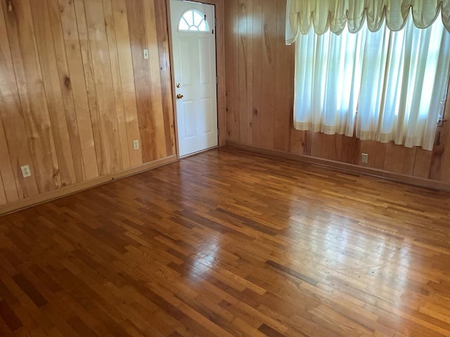 419 Adams St, Marion, VA 24354 - spare room with hardwood / wood-style floors and wood walls