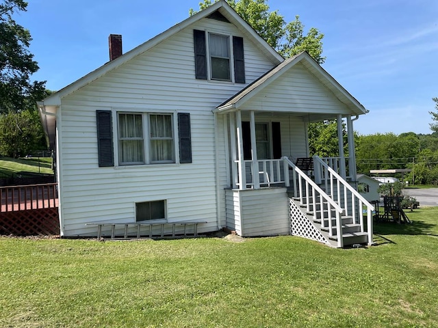419 Adams St, Marion, VA 24354 - bungalow-style home featuring a chimney, a front lawn, and covered porch